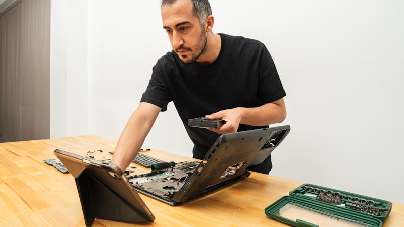 Technician checking a laptop